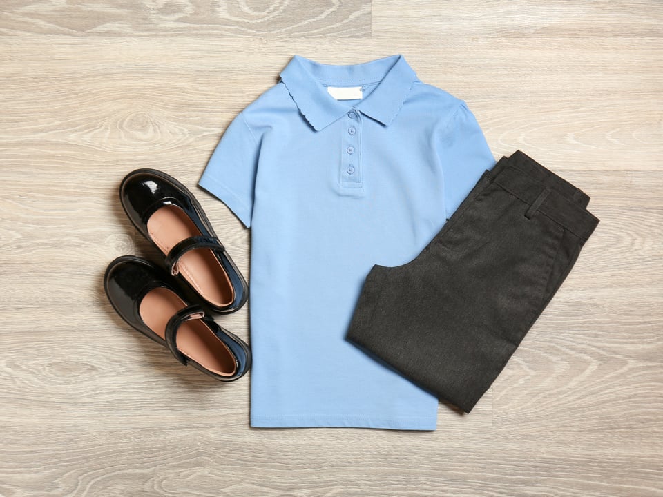 School Uniform on Wooden Background